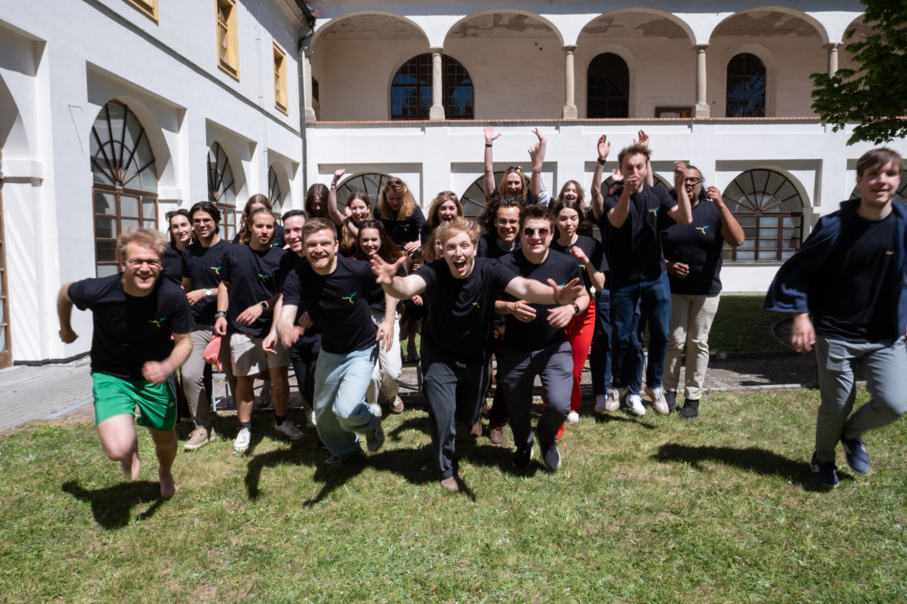 Cross Border Dialogue participants gathering in a historic courtyard
